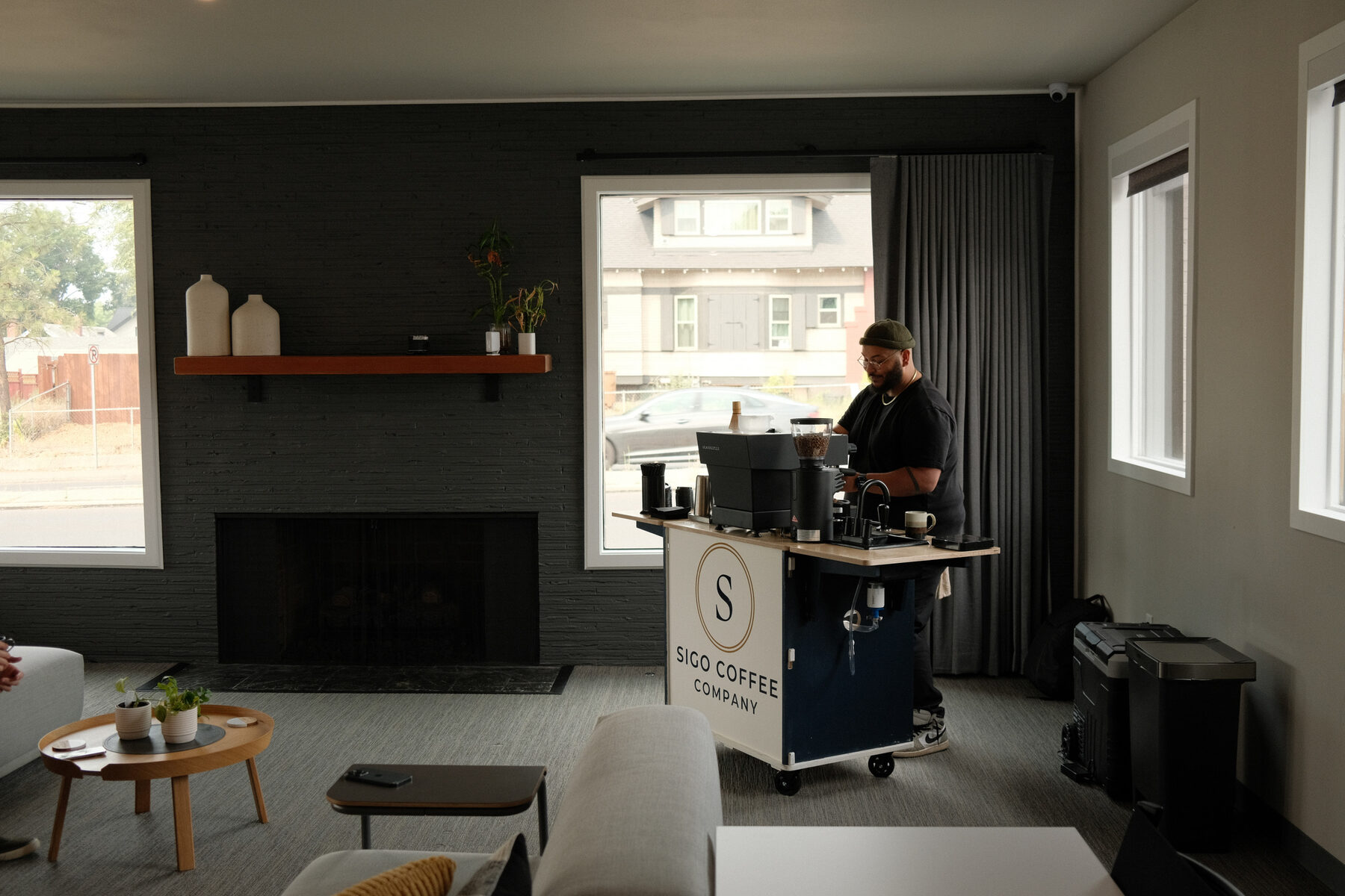 The Sigo Coffee Company cart set up in a Spokane office lounge, La Marzocco and grinder on the counter