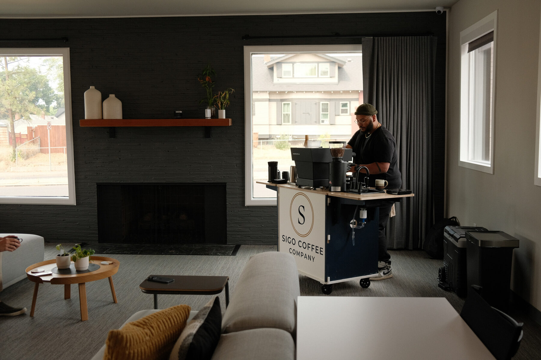 The Sigo cart serving in a lounge space, a finished latte waiting on the counter