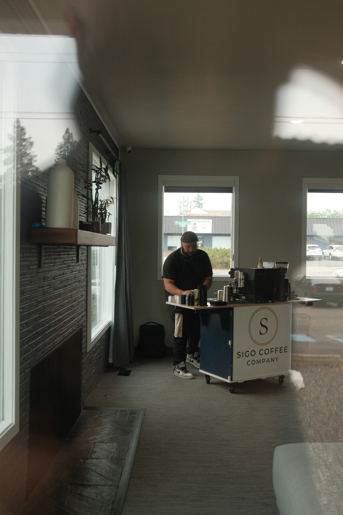 The Sigo cart positioned near a window, branded panel facing the room