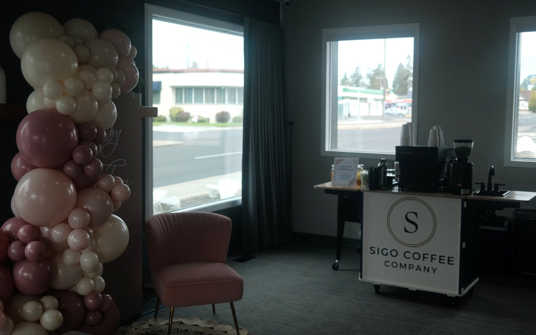 Sigo Coffee Company cart ready for guests beside a balloon garland and pink lounge chair at a private party in Spokane